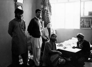 The collaborator Massimo Mininni with the Sufi master Barang and his assistants, Peshawar Pakistan, courtesy of Alighiero Boetti Archive